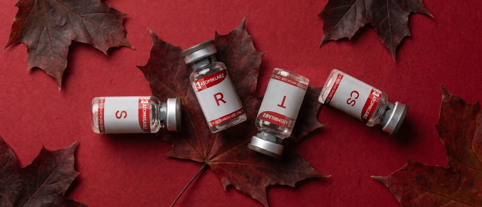 Atomik Labz Peptides S, R, T and CS on deep red autumn leaves